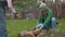 Couple breaking a tree branches for a bonfire