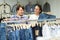 Couple buying blue jeans at store