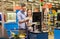 Couple buying food at grocery at cash register