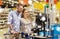 Couple buying food at grocery self-checkout