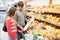 Couple buying French baguette