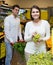 Couple buying fresh seasonal fruits in market