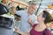 Couple buying grill accessories in hardware store