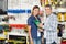 Couple Buying Product In Hardware Store