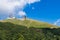 Couple of cable cars climbing mountain