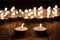 Couple of candle and blurry candles on old wooden