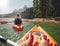 Couple canoeing in the lake on a summer day