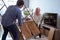 couple carrying new furniture together at their house