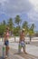 Couple carrying Scuba Tanks in the Caribbean