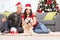 Couple celebrating Christmas together with their dog