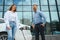 Couple on the charging station for electric vehicles