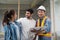 Couple checks the work of a contractor building a house for them.