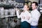 Couple choosing glasses in store