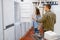 Couple choosing refrigerator in electronics store