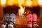 Couple in Christmas socks near fireplace