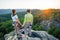 Couple of climbers resting and enjoying beautiful nature view