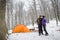 Couple climbers in a winter time near the mountain camping