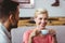 Couple with coffee cup sitting on sofa