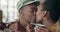 Couple, coffee and happy with kiss at restaurant, cafe or diner for bond, communication or love. Black people, man and