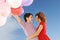 Couple with colorful balloons