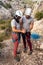 A couple of concentrated climbers check the eight knot on her harness before starting to climb