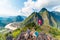 Couple conquering mountain top at Nong Khiaw panoramic view over Nam Ou River valley Laos national flag scenic mountain landscape