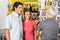 Couple Conversing With Man In Hardware Store