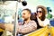 Couple in convertible. Beautiful young couple enjoying road trip in convertible and looking at each other with smile