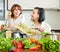 Couple cooking veggy lunch