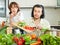 Couple cooking veggy lunch