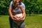 Couple creating a love heart with their hands - pregnancy.