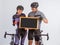 couple in cycling outfit looking at the blackboard