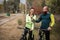 Couple of cyclists resting in park