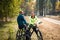 Couple of cyclists resting in park