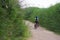 Couple of cyclists taking a walk on the lake, Lleida