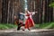 Couple dancing in russian traditional dress on nature