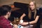 Couple is on date in cafe drinking coffee, girl