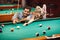 Couple dating and spending time together by playing billiard