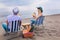 Couple on a deck chair relaxing on the beach.