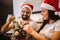 Couple decorates a Christmas tree at home