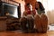 Couple with delicious cocoa near fireplace at home, focus on feet. Winter vacation