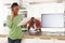 Couple Discussing Personal Finances In Kitchen