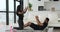 Couple doing abdominal endurance training exercise at home