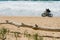 couple doing electric fatbike on the beach