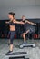 Couple doing exercises over steps in fitness center