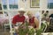 Couple dressed in red, white and blue relax in cafï¿½ during Fourth of July celebration in Ojai, CA