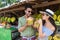 Couple Drink Coconut Asian Fruits Street Market Buying Fresh Food, Young Man And Woman Tourists Exotic Vacation