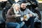 Couple drinking coffee near motorcycle