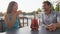 Couple drinking sangria toasting happy having fun sitting at cafe table
