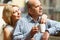 Couple drinking tea at balcony